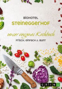 Cover des veganen Kochbuchs mit einem Messer inmitten von Gemüse